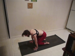 a person is in yoga position on a mat
