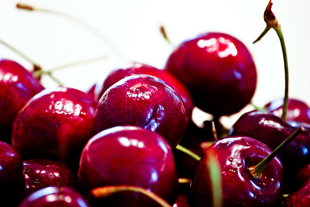 a close up of cherrys in a bowl