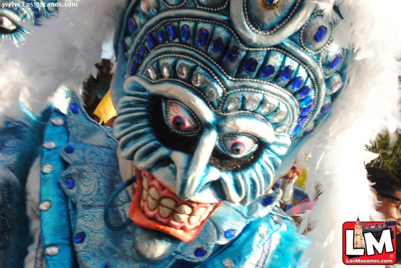 a man with white, blue and silver hair in a mask