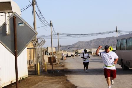 people running down the street in a race