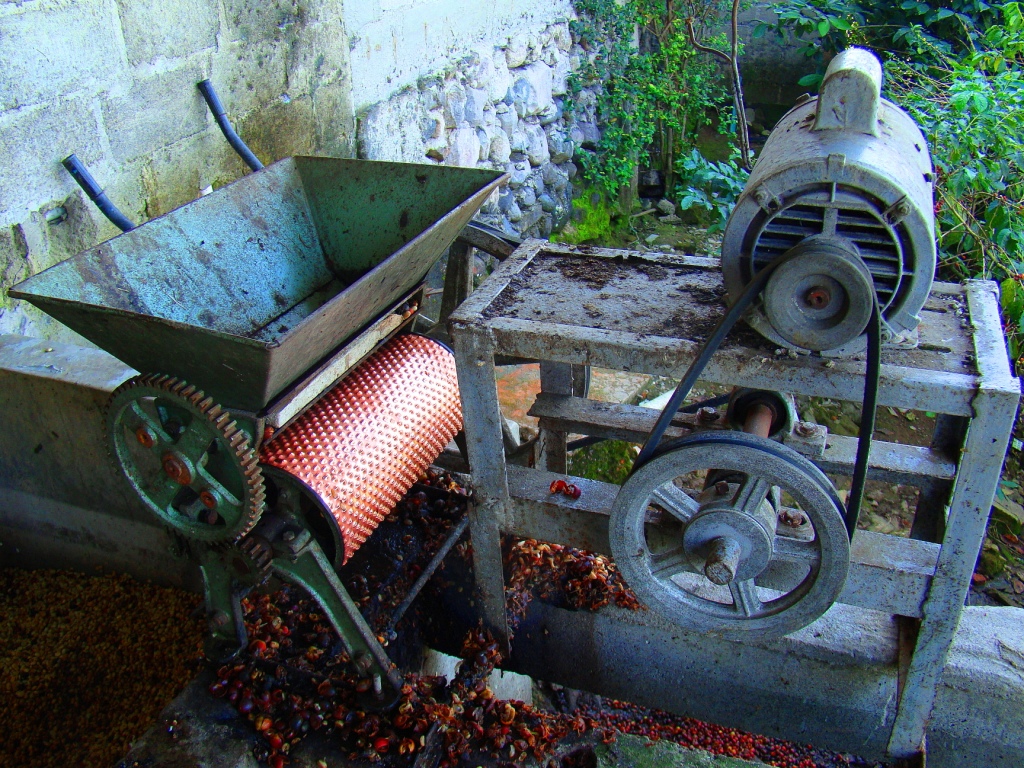 two old mixers that are on a wooden cart