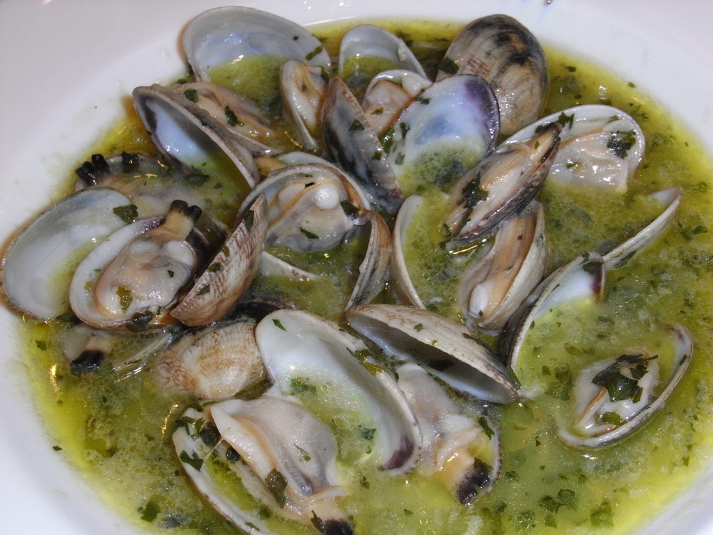 the bowl is filled with soup of fresh shell clams