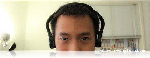 a man wearing headphones and staring into the camera