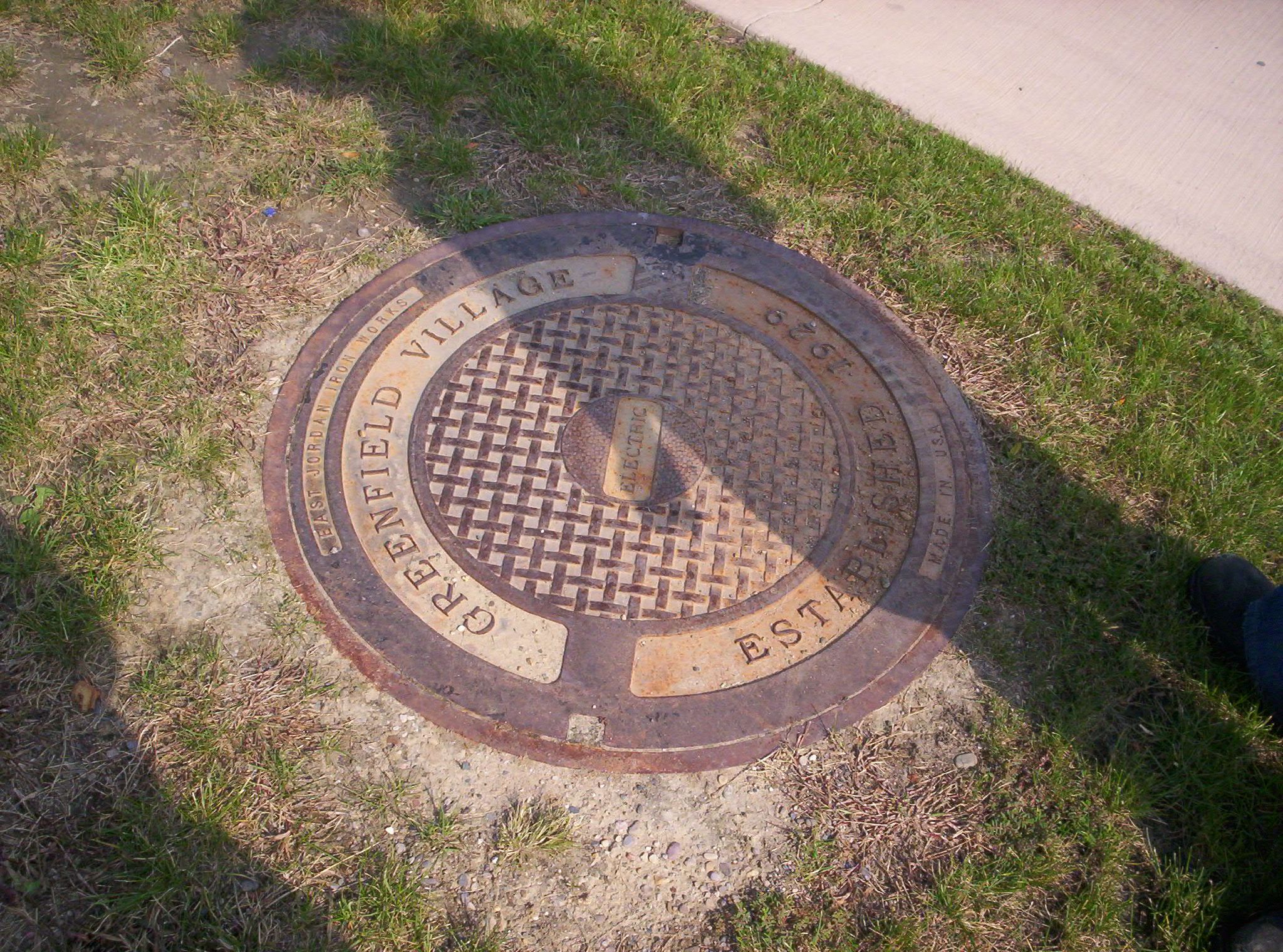 a manhole cover with a design in the center