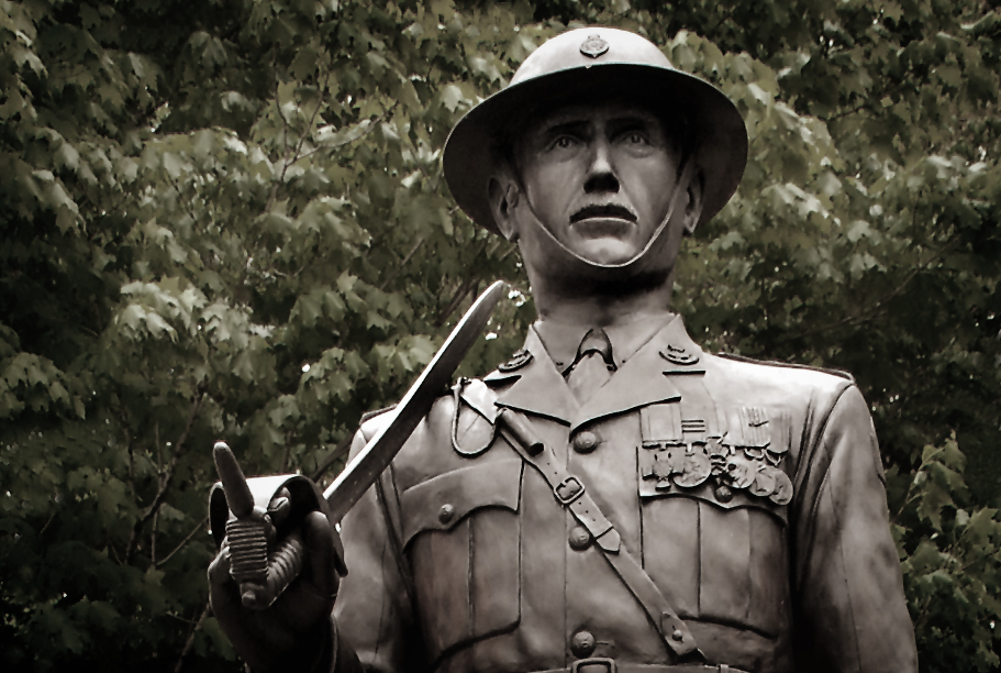 a statue with a gun in his hand and an army uniform