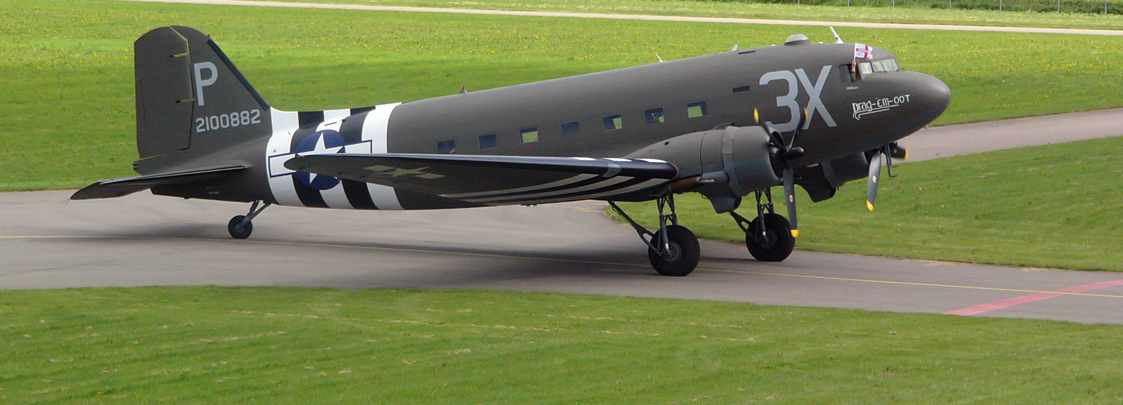 a grey airplane that is sitting on the ground