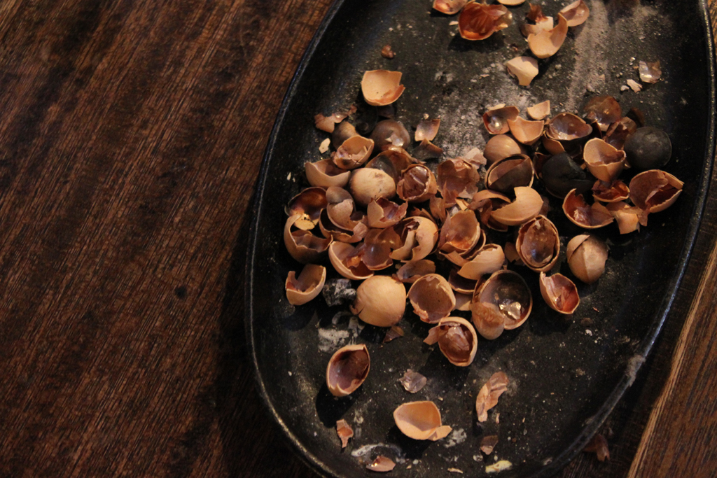 several pieces of peeled nuts on a tray