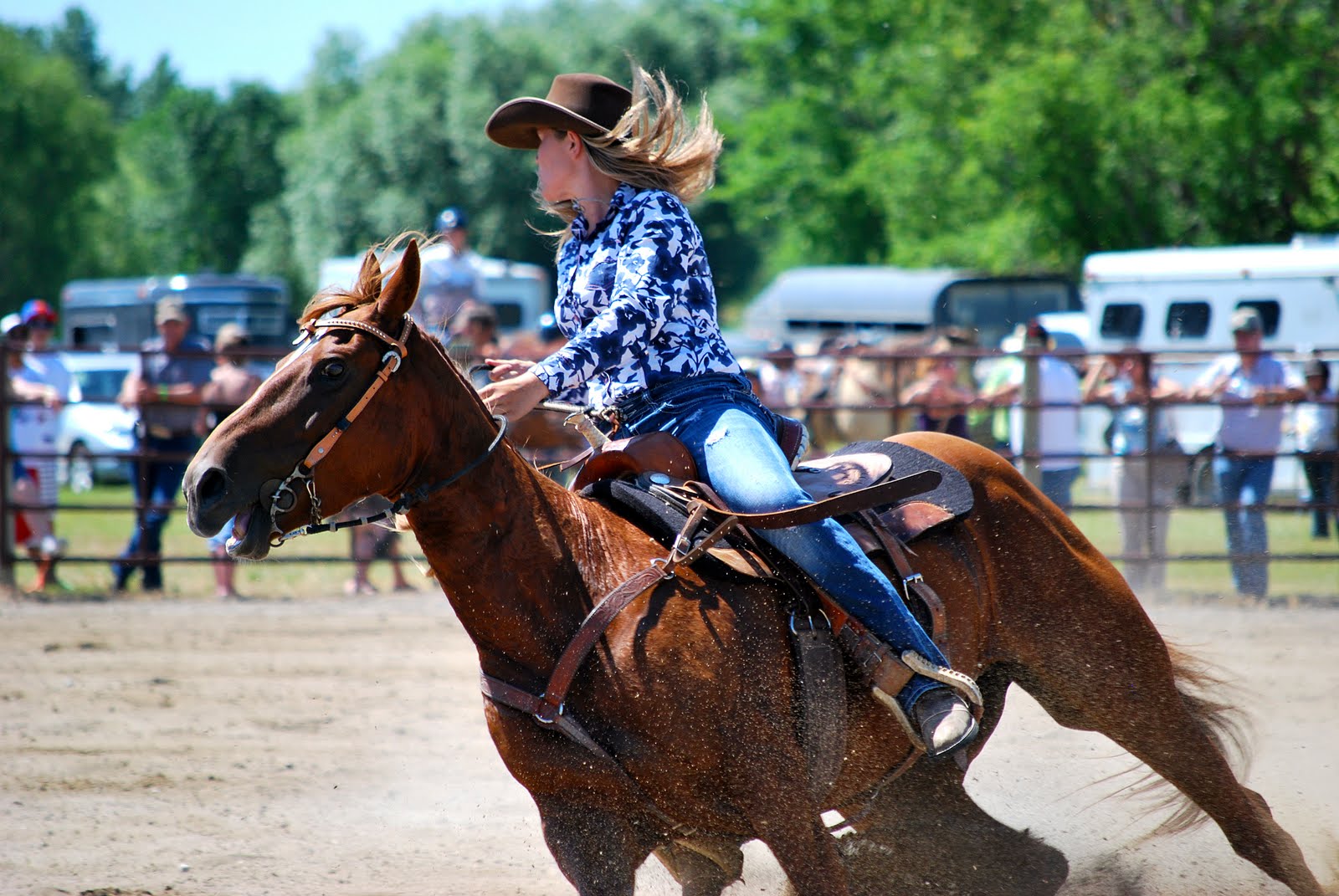 a lady that is riding on the back of a horse