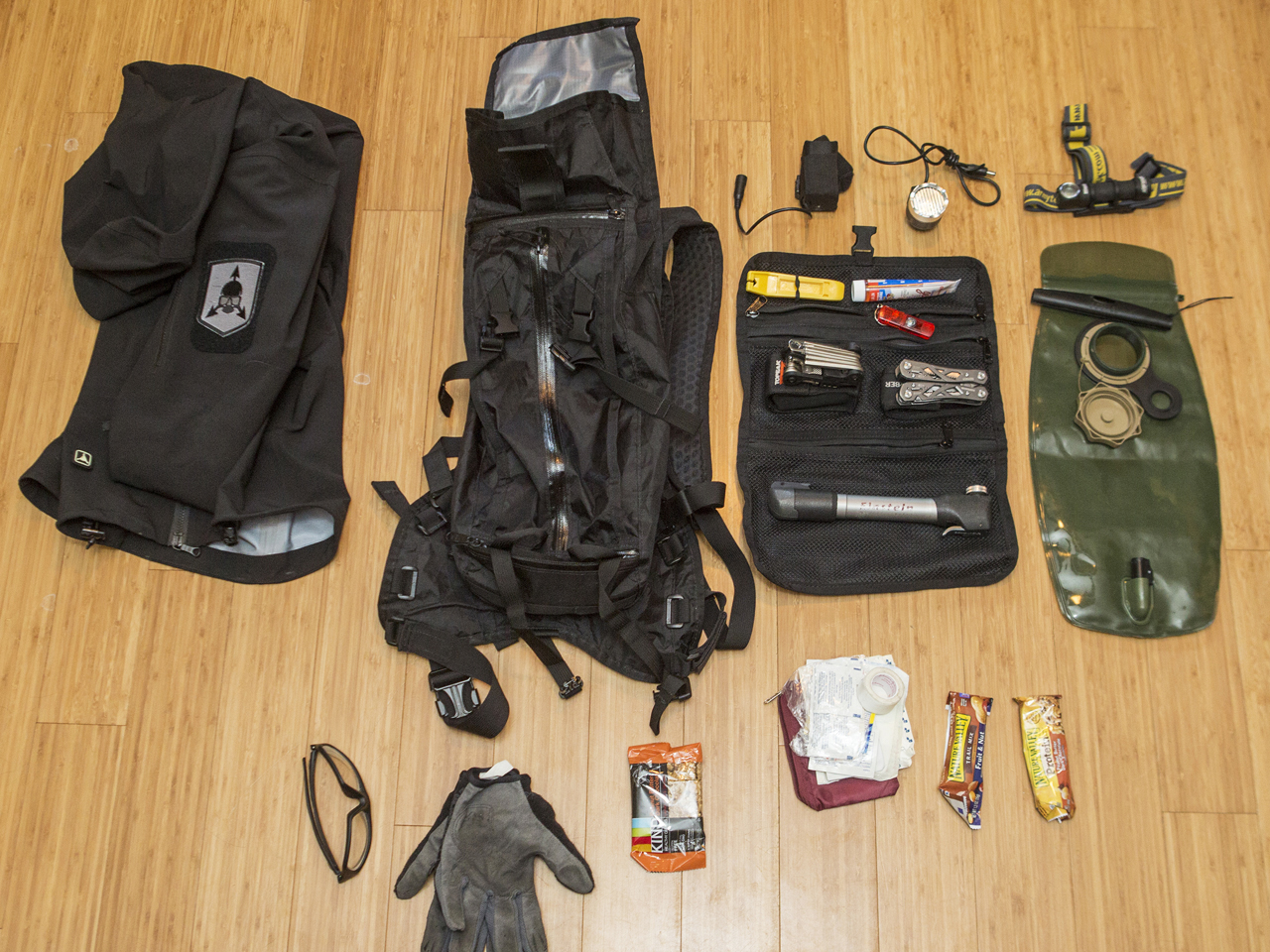 several items laying on the floor next to a pair of gloves