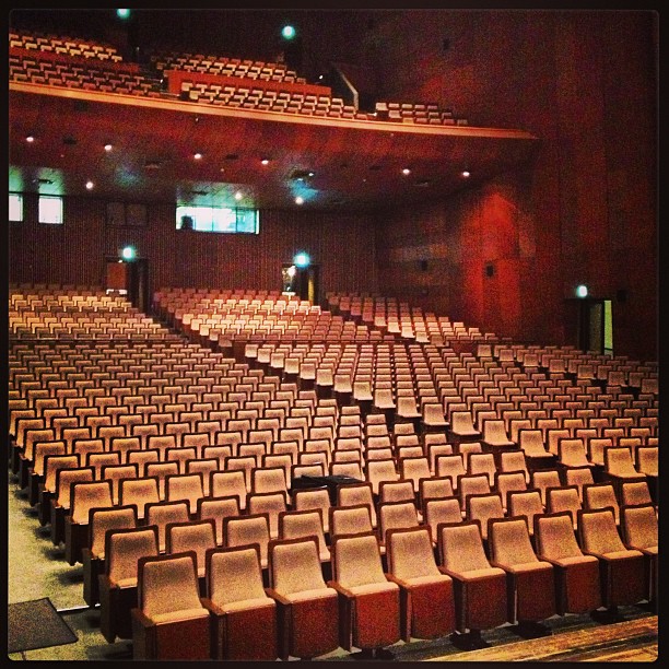 empty auditorium with no people in sight but many seats