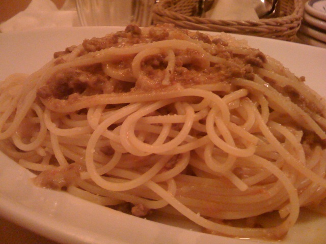 a plate full of spaghetti with meat and sauce