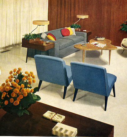 a room is shown with chairs and couches