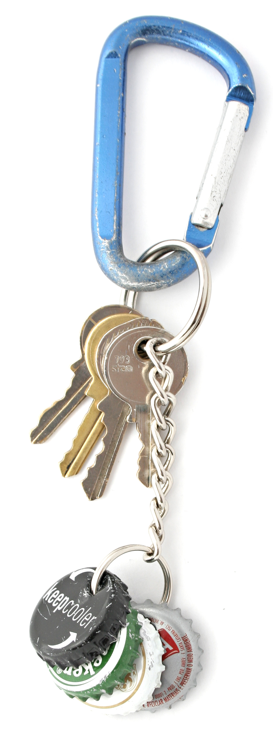 a blue keychain is on top of several other key rings