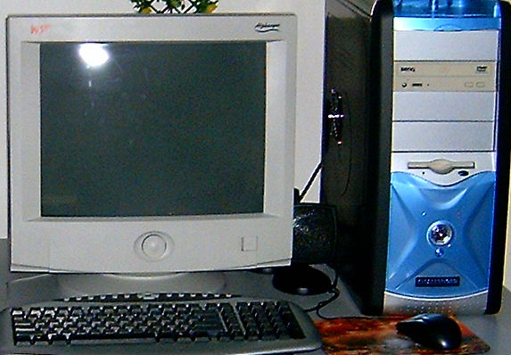 a desktop computer is on display with a mouse