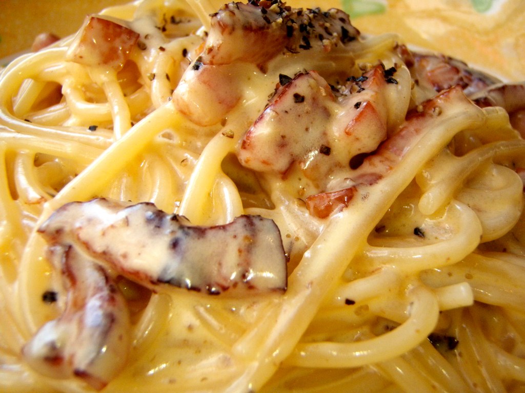 a pasta dish with noodles, shrimp and spices