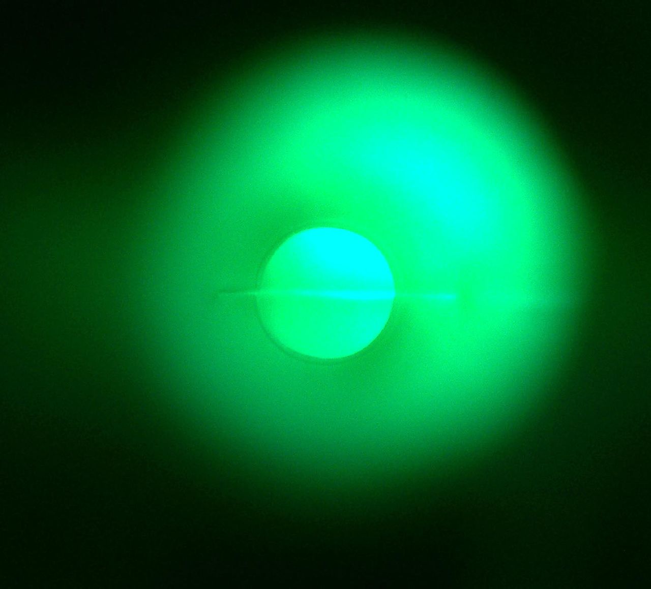 a green light emitting a green circle