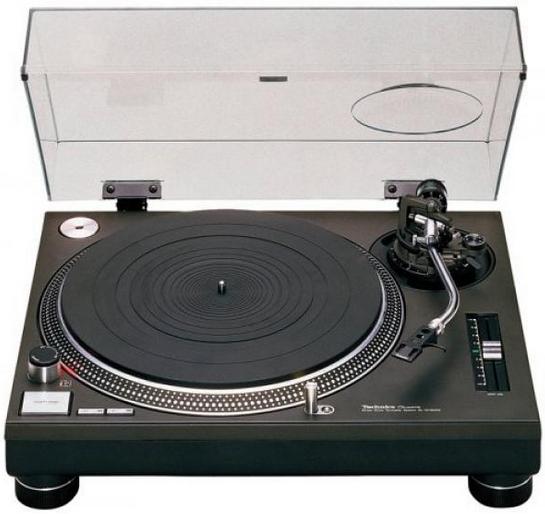 an open record player is sitting next to other electronic equipment