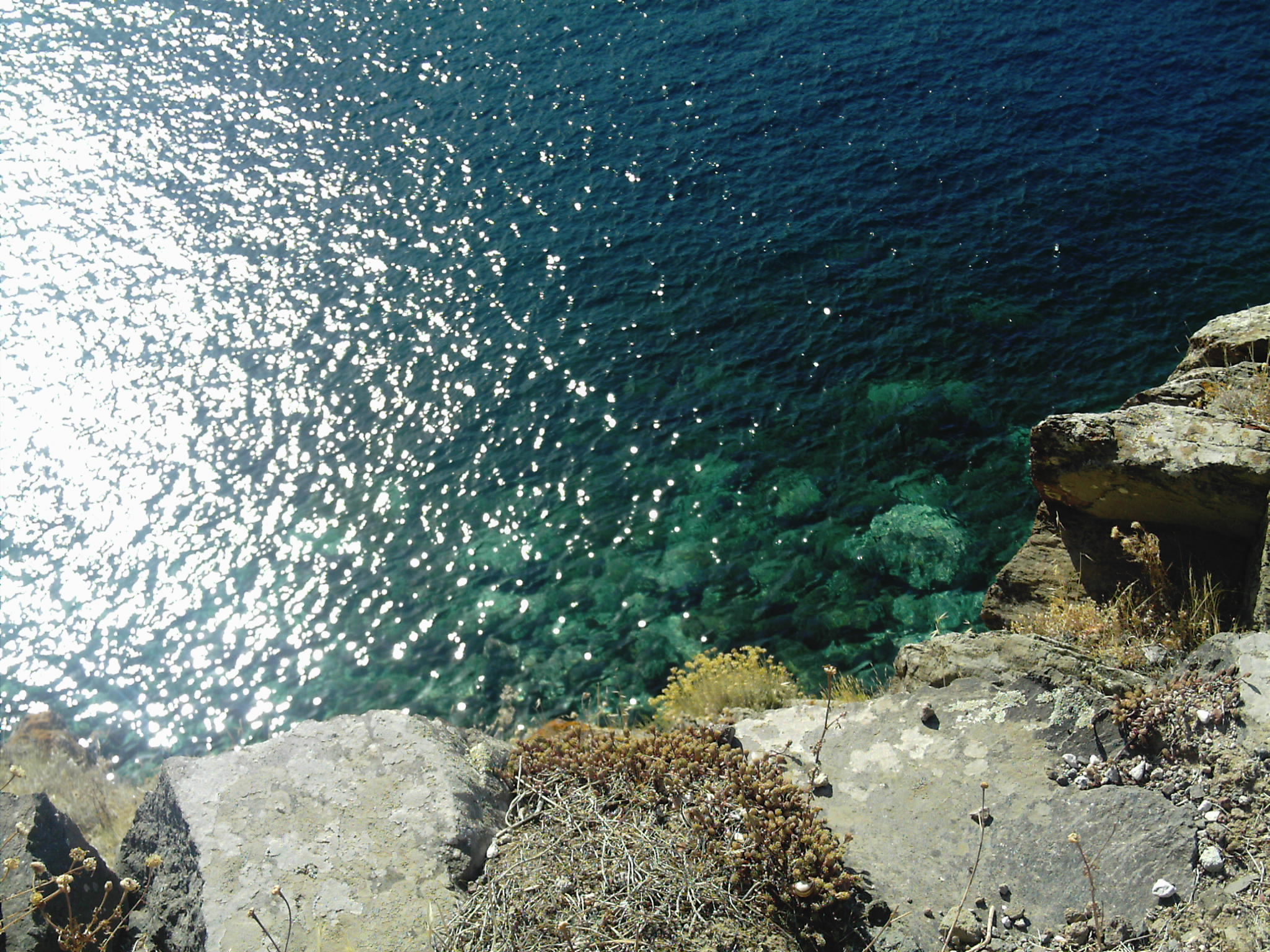 clear water and rocks in a large body of water