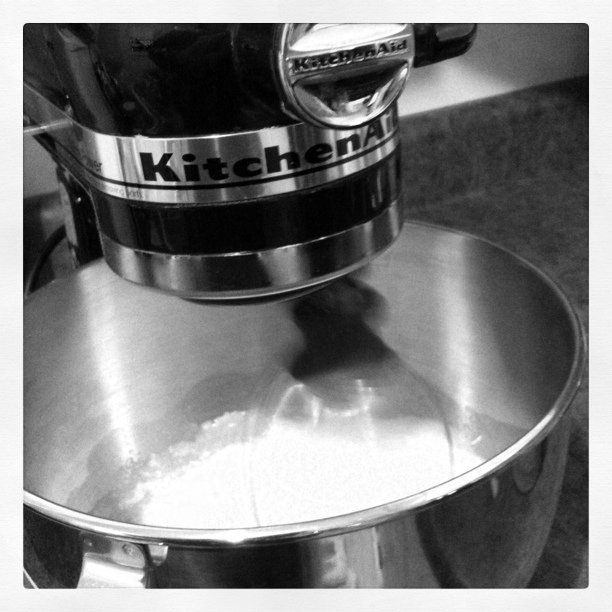 a mixer with the word kitchen on it is shown in black and white