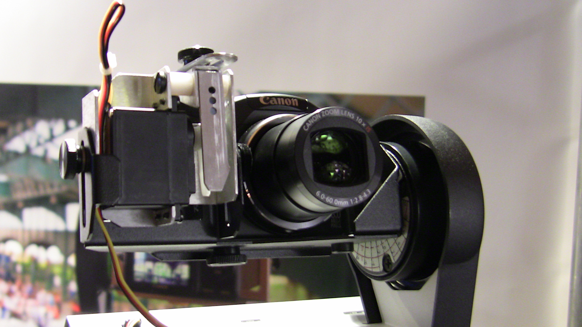a camera on a tripod with the lens off