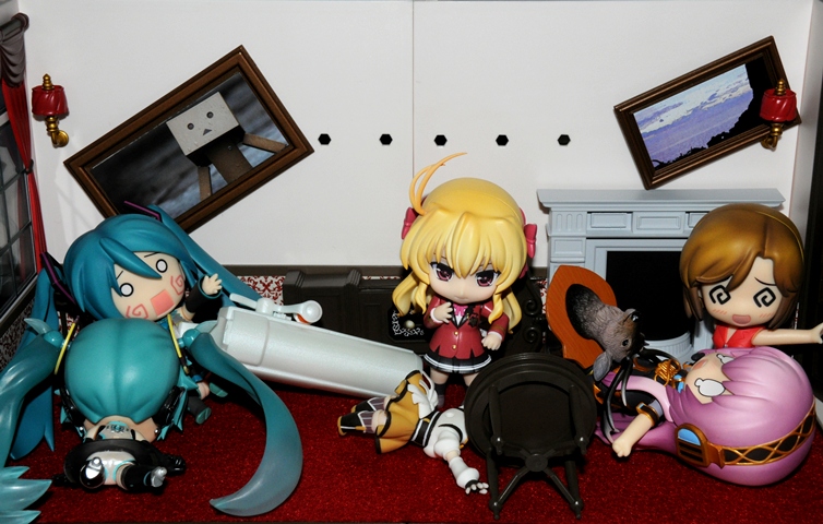 an assortment of anime figurines sitting on a red carpet