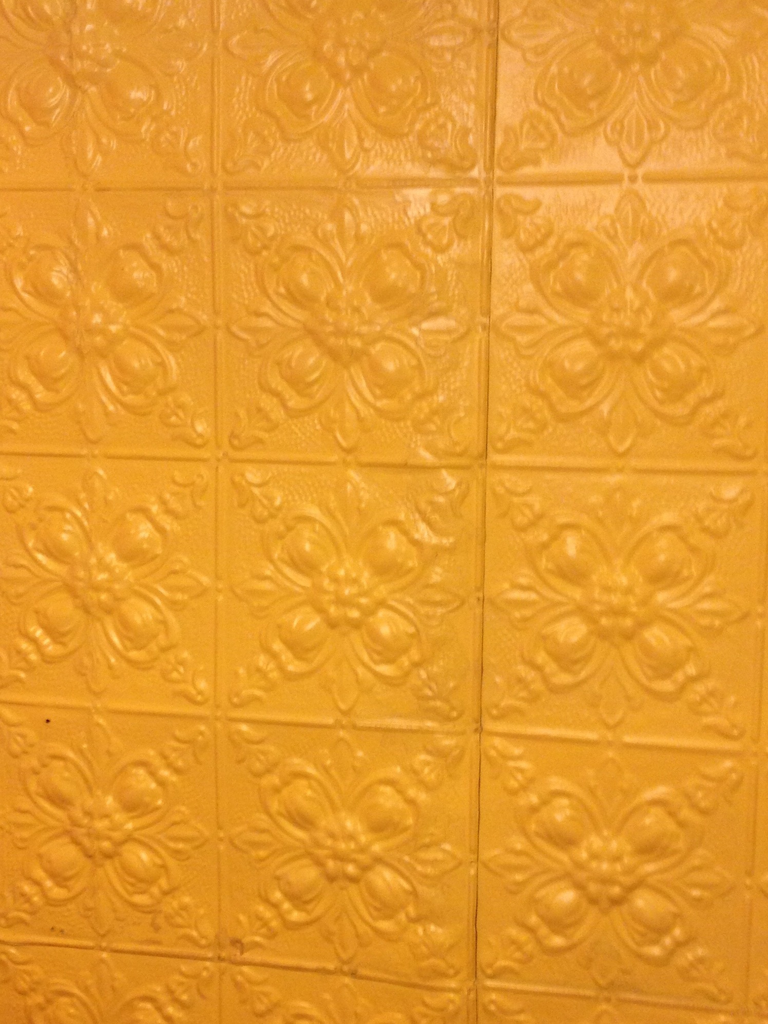a wall covered in a tile pattern with only two different colors