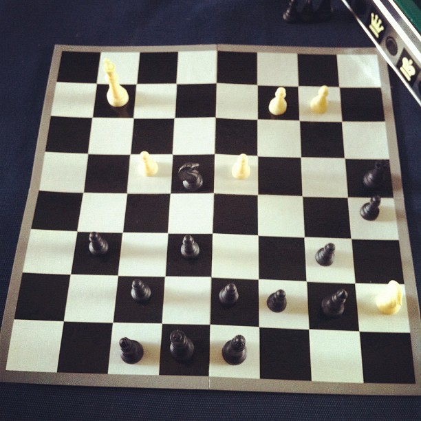 a large chess board with pieces of the game being drawn