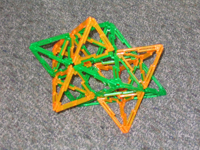 a close up of a triangle made of plastic construction blocks