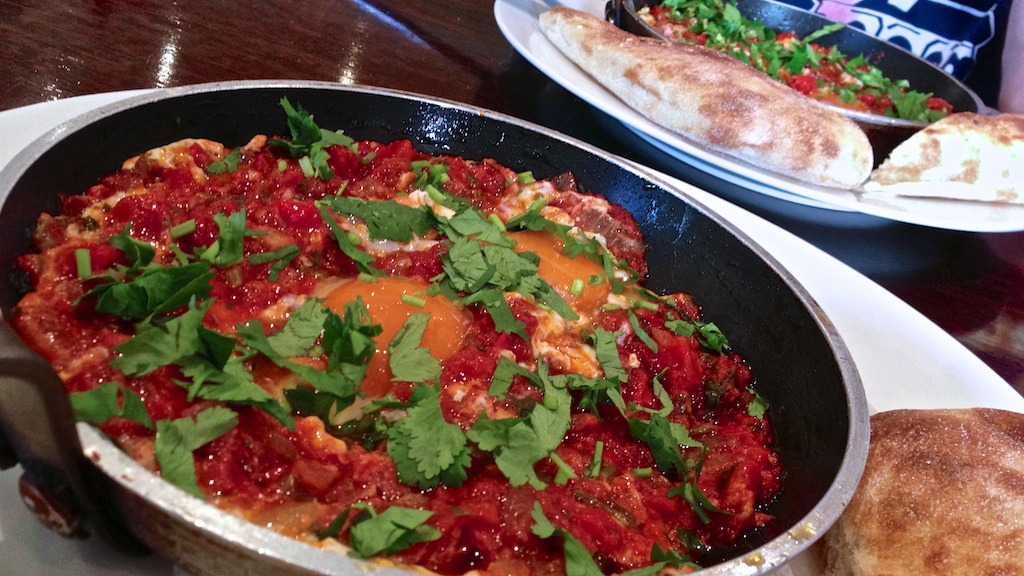 a pan of food on a table in a restaurant