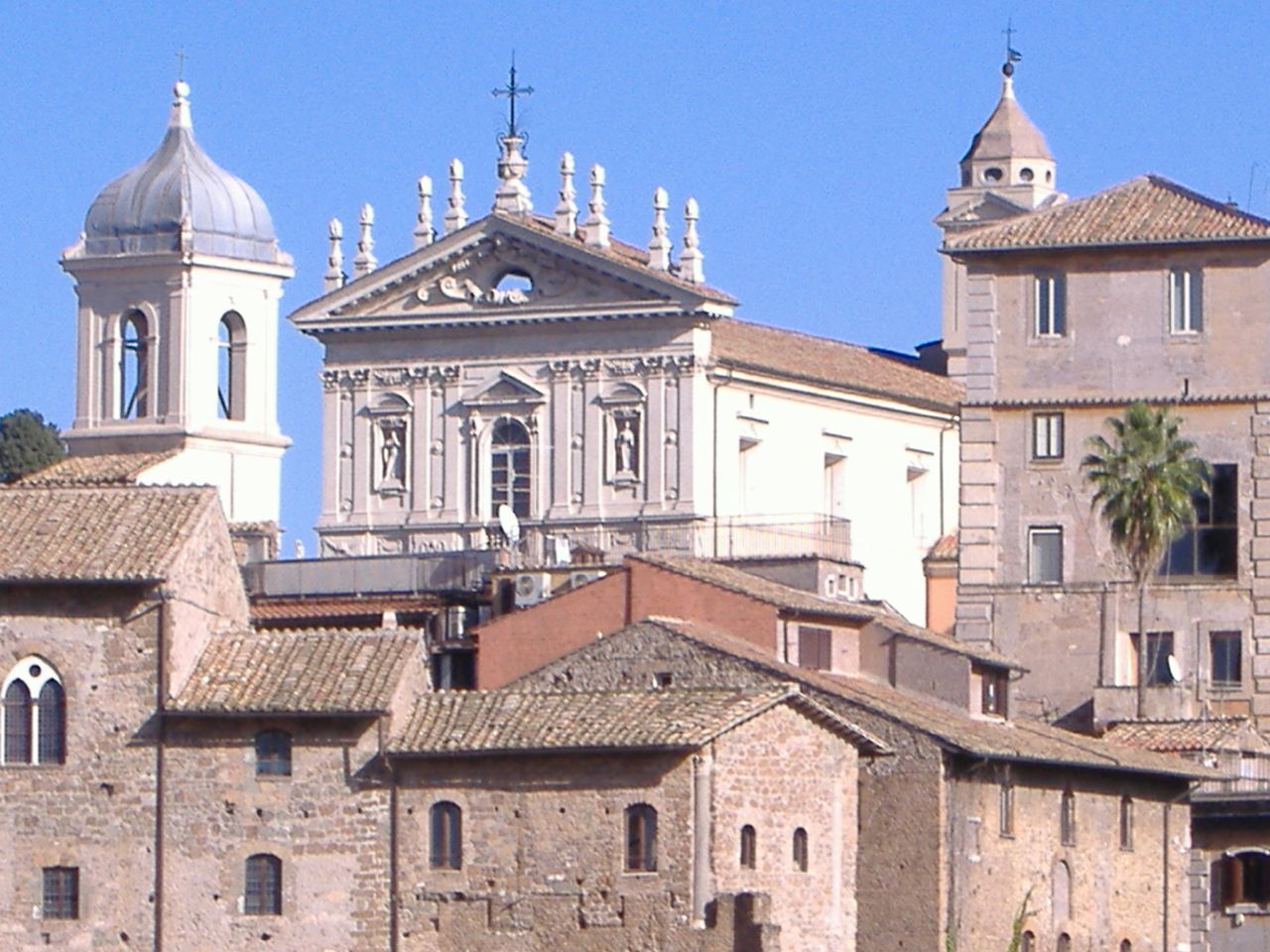 buildings with a bell tower towering above them
