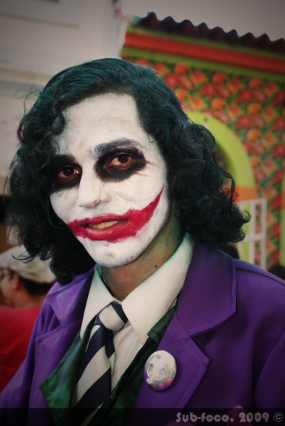 a male clown dressed in an joker costume