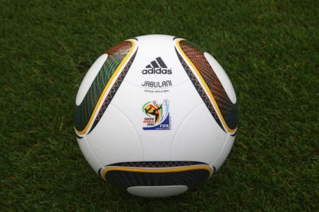 a soccer ball sits on the grass