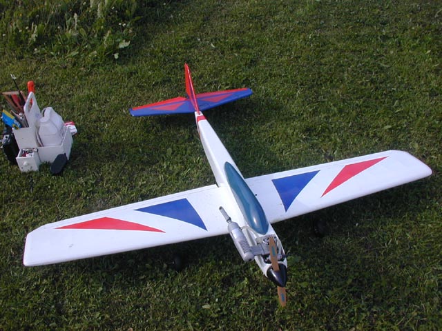 a small toy plane sitting on top of a field