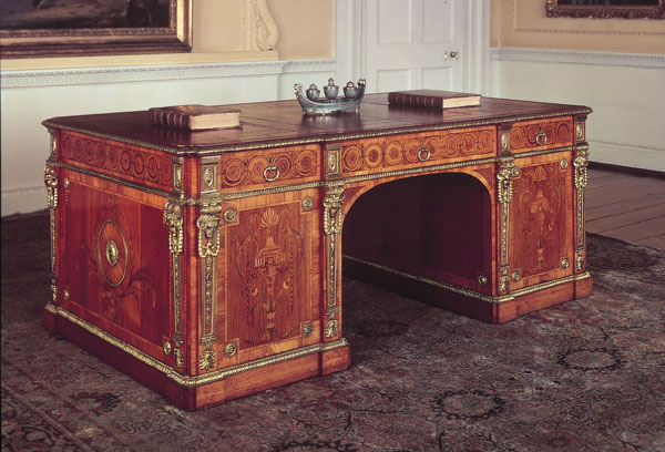 a fine antique desk with carved wooden carvings