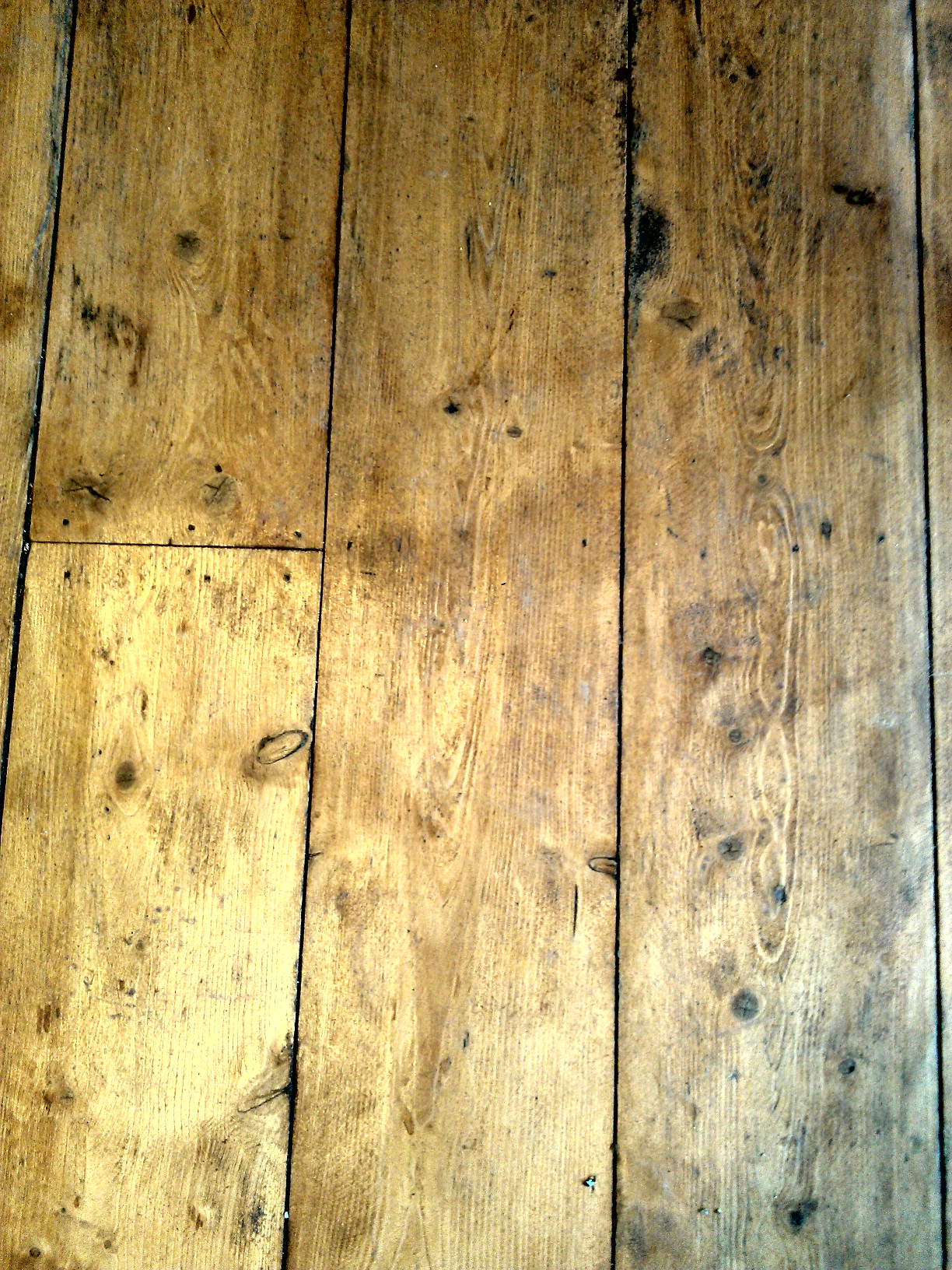 an old, worn, wooden floor with lots of s in it