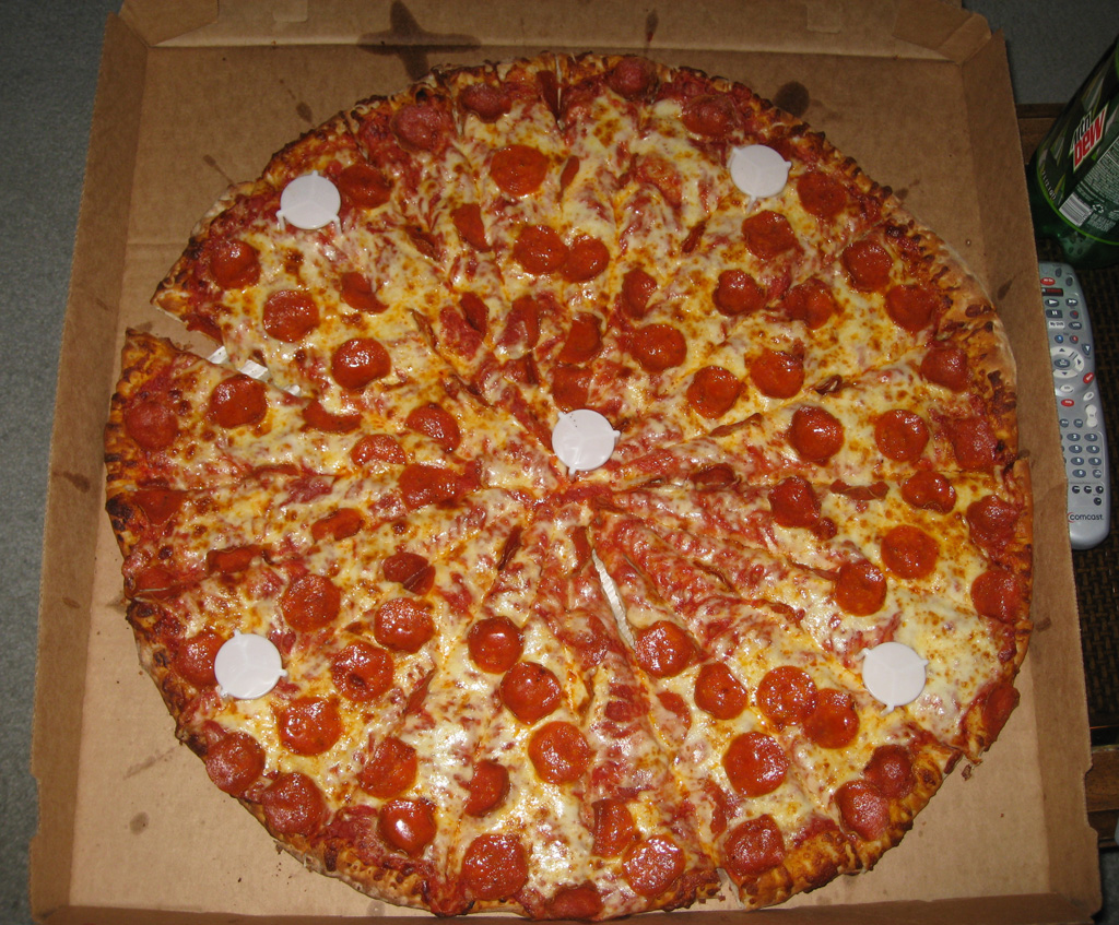 a pizza that has pepperoni and cheese on it