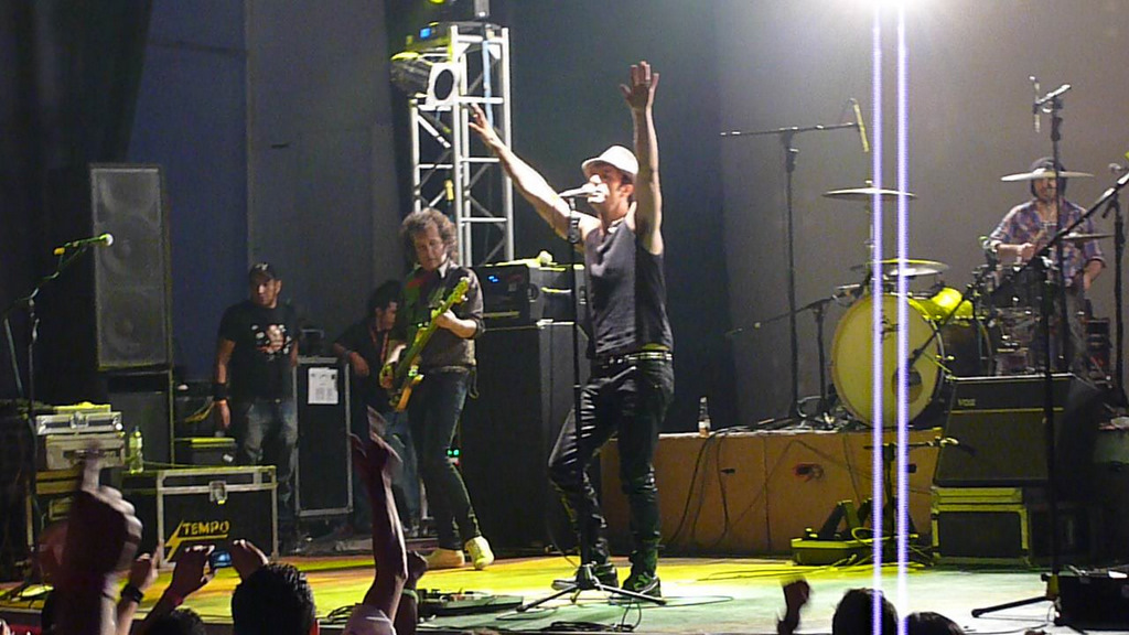 a group of young people singing on stage