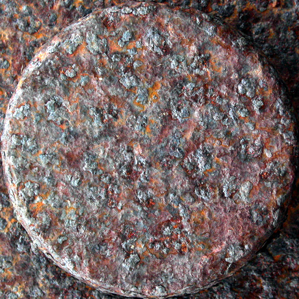 an artistic circular object with a dark red color