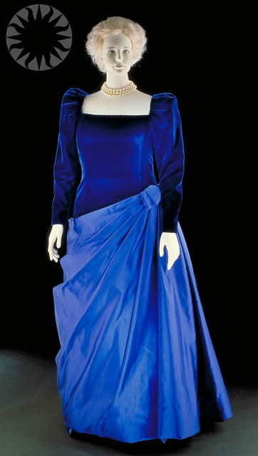 a blue dress with black sleeves and a white neckline