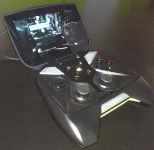 a controller attached to a phone holder on a desk