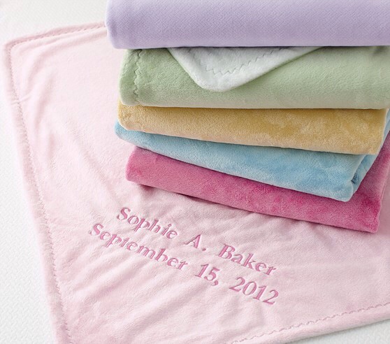 towels in pink, green, blue and yellow with a date on them
