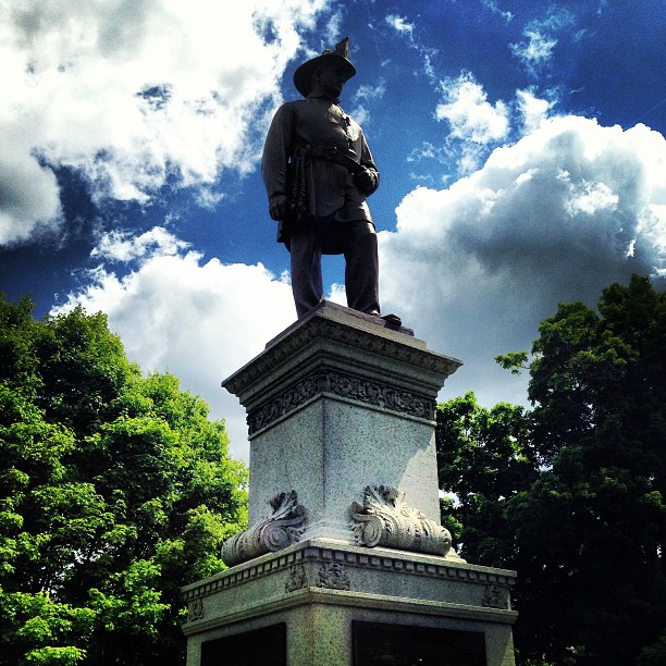 a statue in the middle of a park