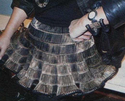 a woman in a short skirt that has a purse over it