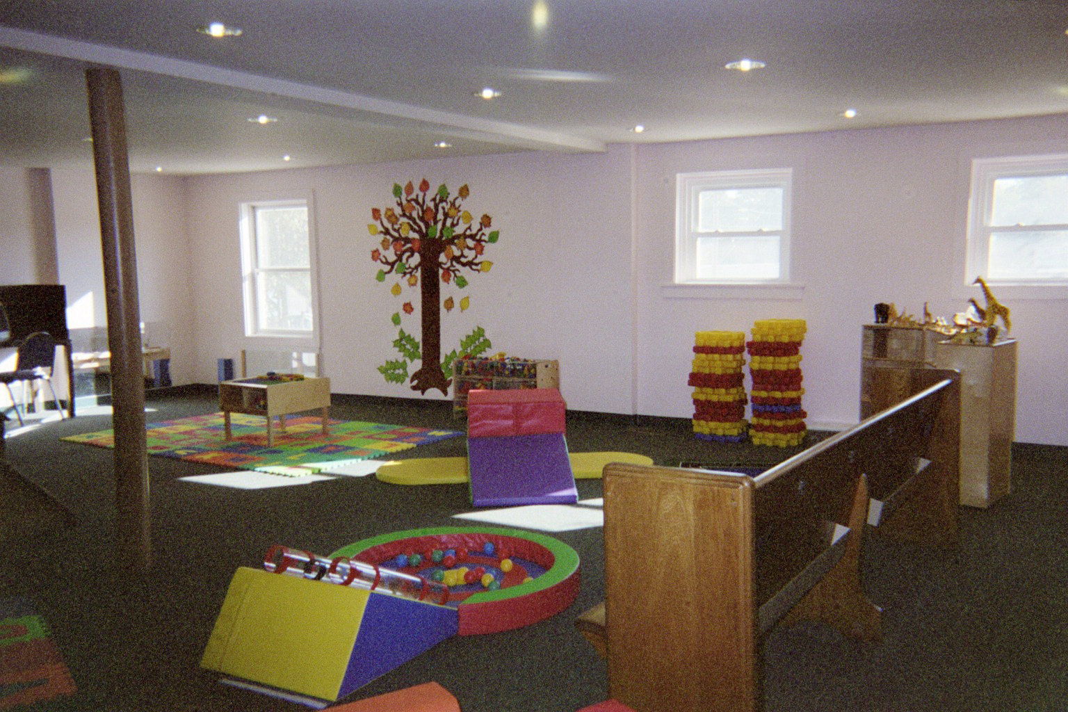 a living room filled with furniture and lots of small toys