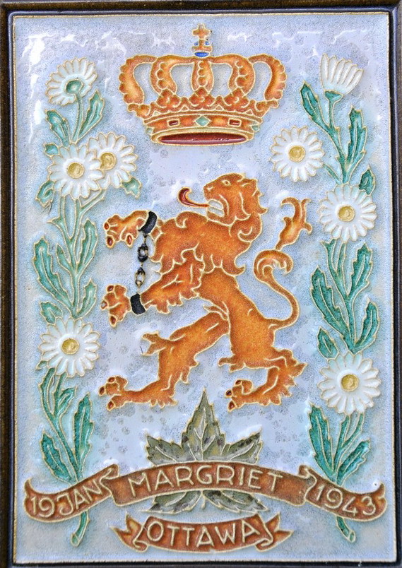 a tile in the shape of a lion and crown