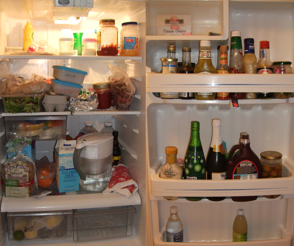 a white refrigerator with bottles and containers of food inside