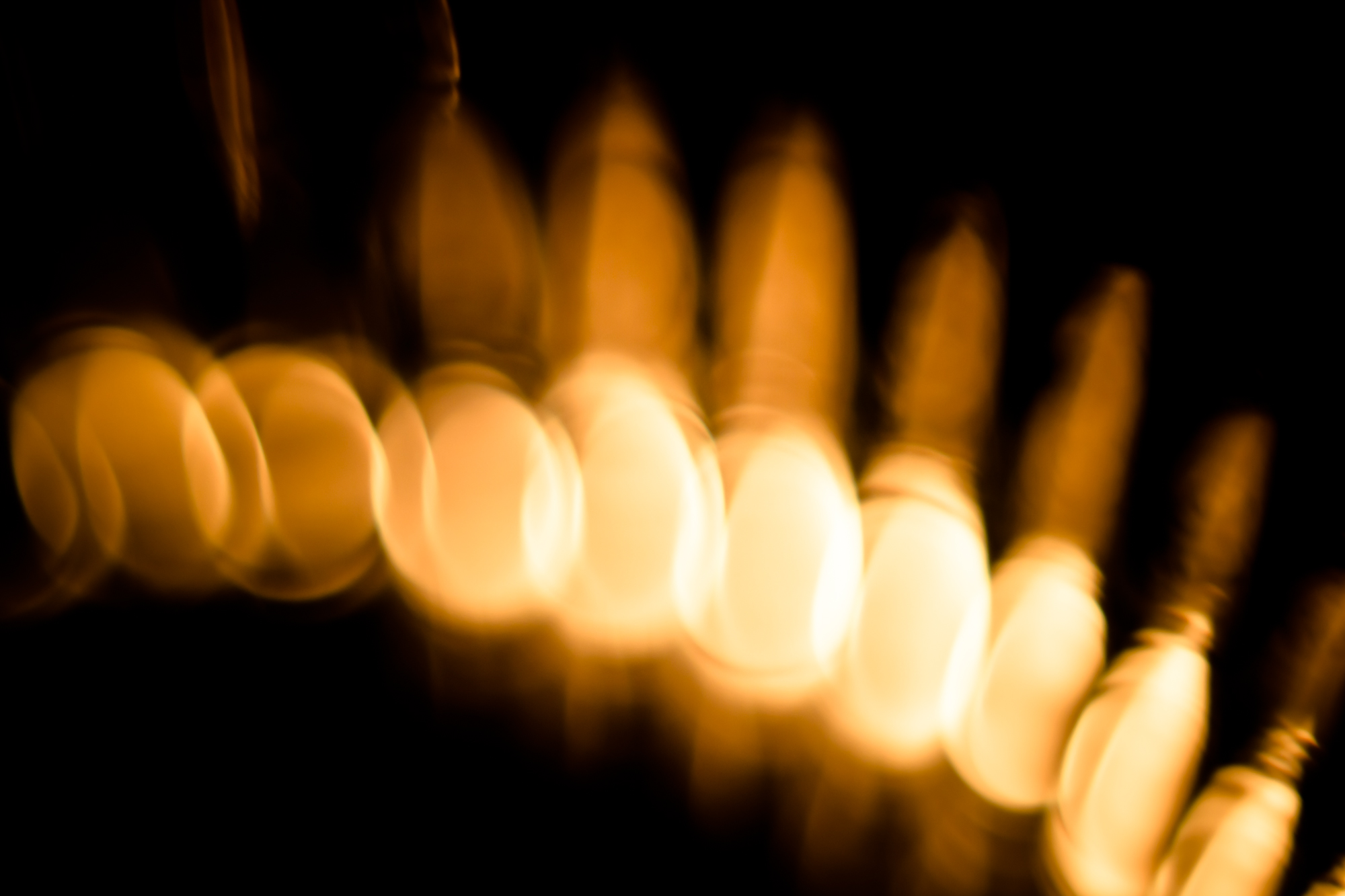 blurry image of candles with long exposure