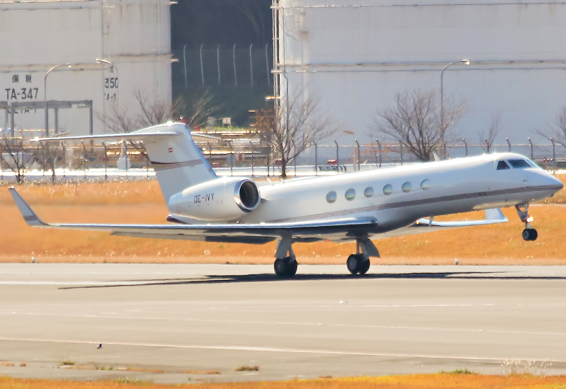 an airplane sitting on the runway at an airport