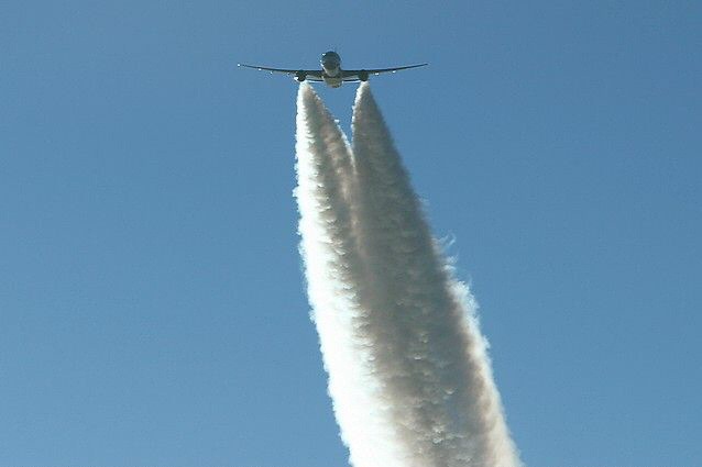 a plane flying very high up in the sky