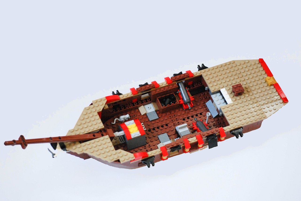 the back side of a lego boat is seen up in the air